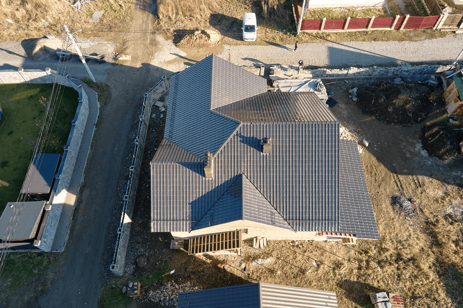 Aerial view of a freshly shingled roof installed by Rescue Roofing