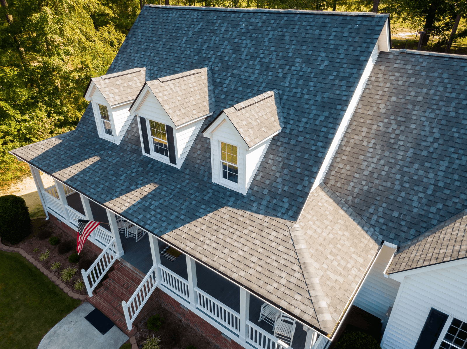 A completed asphalt shingle roof replacement on a Houston home
